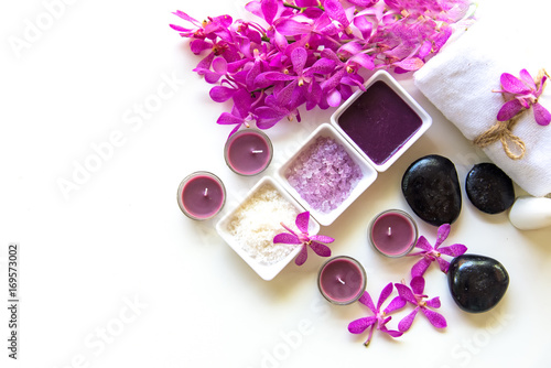 Thai Spa Treatments aroma therapy  salt and sugar scrub and rock massage with orchid flower on wooden white.  Healthy Concept. copy space select and soft focus