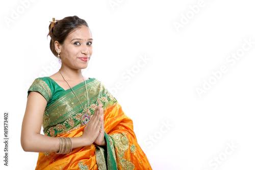 Happy young beautiful traditional Indian woman in traditional saree