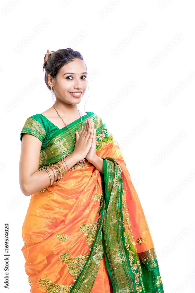 Happy young beautiful traditional Indian woman in traditional saree Happy young beautiful traditional Indian woman in traditional saree