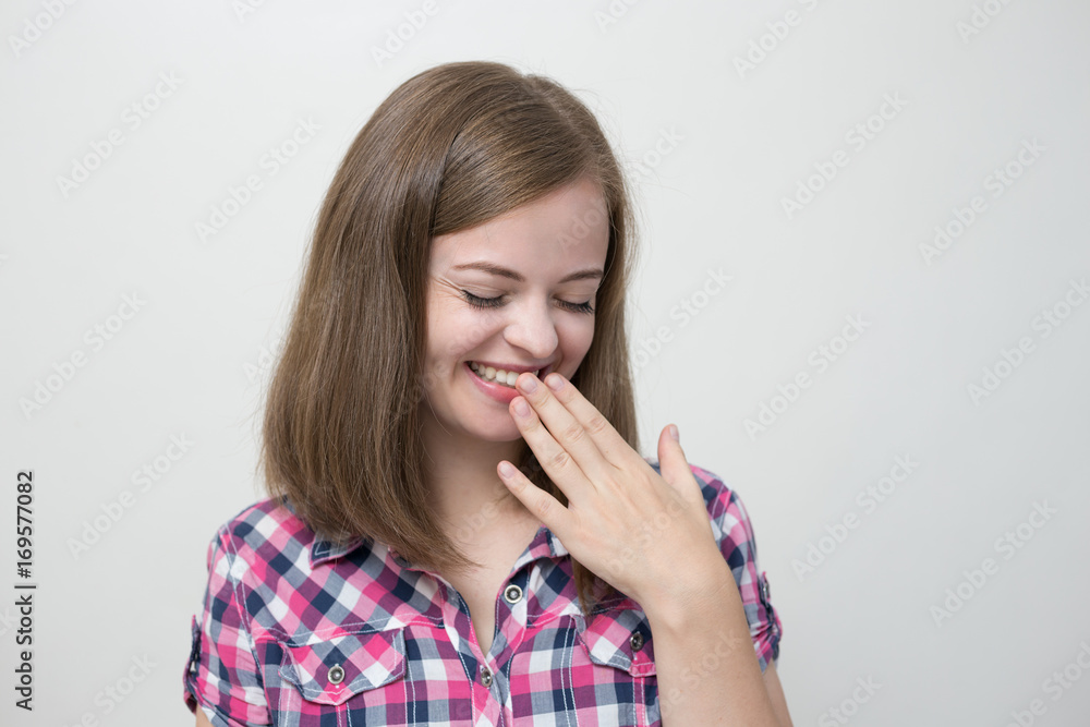 Cute caucasian girl looks embarrassed, shy or flattered Cute caucasian girl looks embarrassed, shy or flattered