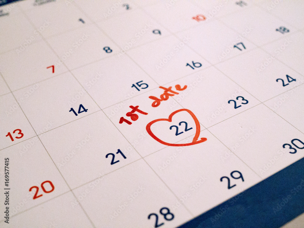 Red first Date marked on white calendar agenda target date for romance and dating. Red first Date marked on white calendar agenda target date for romance and dating.