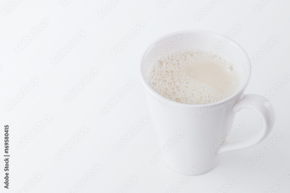 Milk glass on white wooden table. Healthy concept Milk glass on white wooden table. Healthy concept