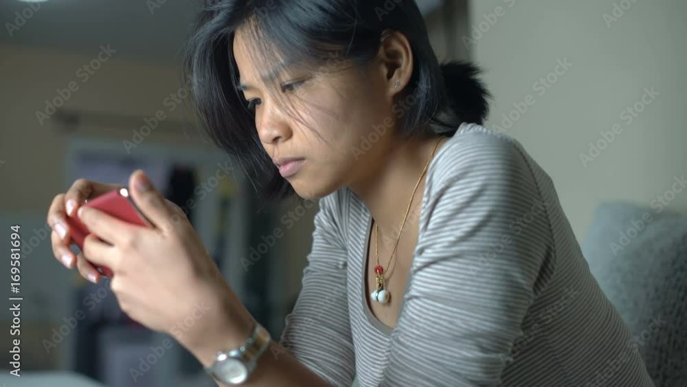 Young Thai girl using smart phone in living room 4k UHD (3840x2160)
Young Thai girl using smart phone in living room 4k UHD (3840x2160)