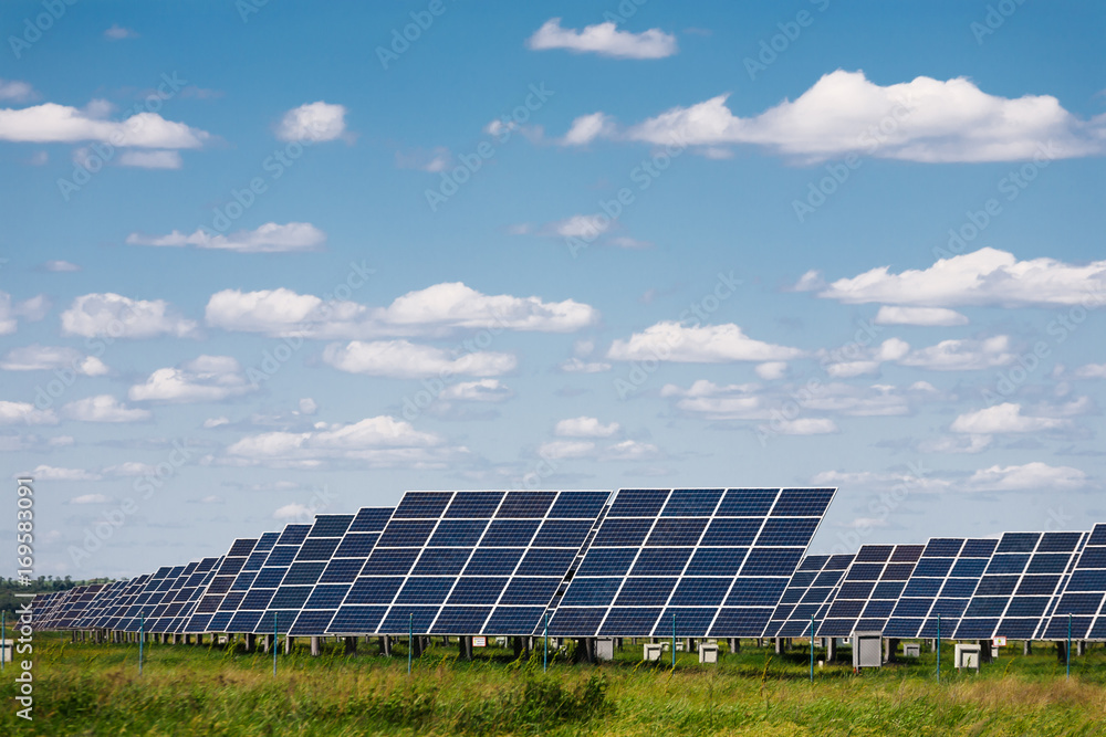 Solar panels against blue sky background