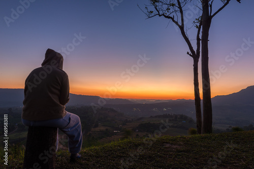 Man looking and waiting for the sun rise