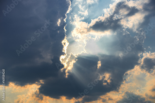Rays of light over the cloud, Light through blue cloud, Sunbeam in the sky