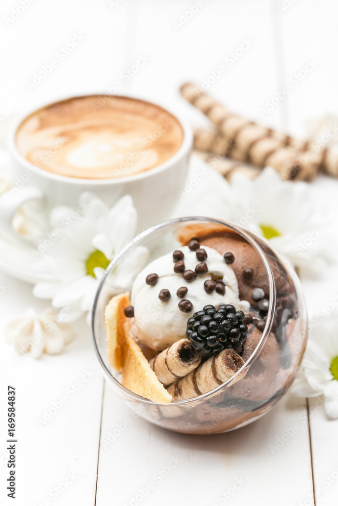 Ice cream with coffee in the background on white table Ice cream with coffee in the background on white table