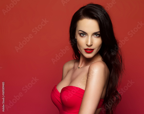 Wallpaper Mural Beautiful female model posing on red background Torontodigital.ca