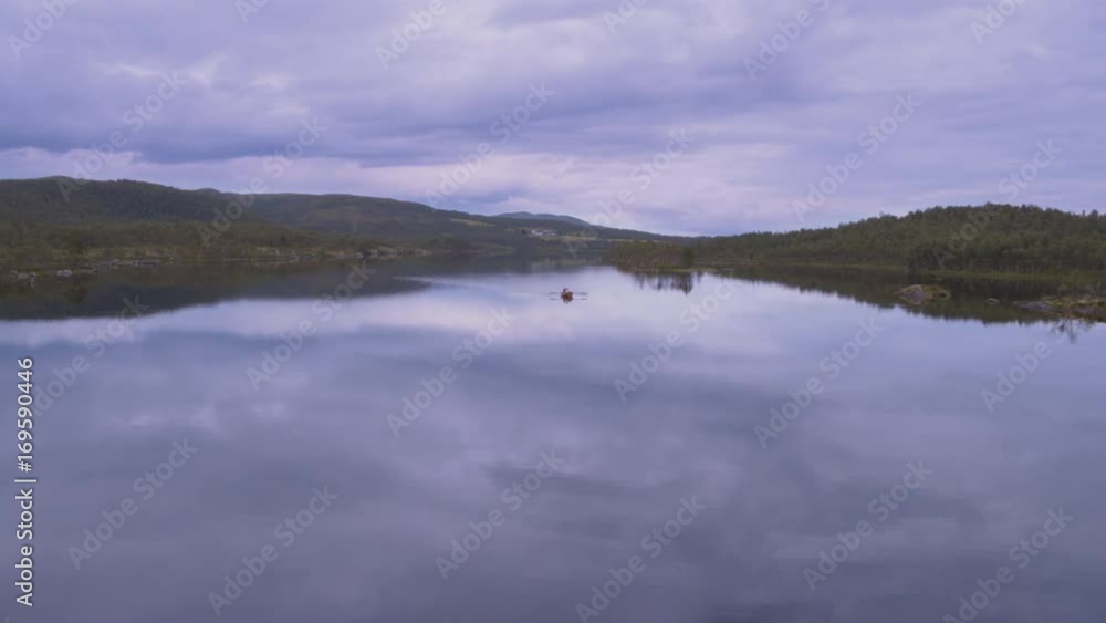 Rowing on calm lake Rowing on calm lake