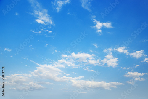 Cirrus clouds in bright blue sky.
