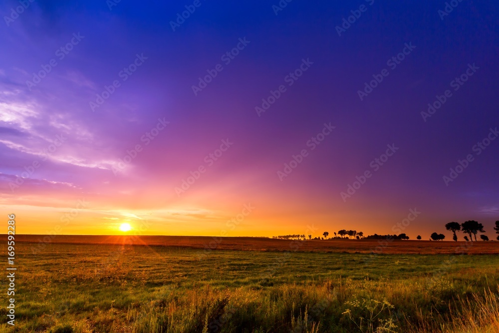 Beautiful sunset sky over meadows