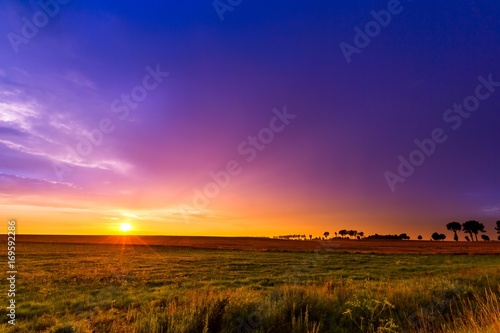 Beautiful sunset sky over meadows