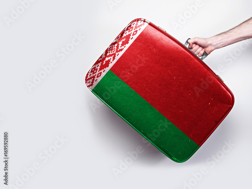 Belarus flag on a vintage leather suitcase.