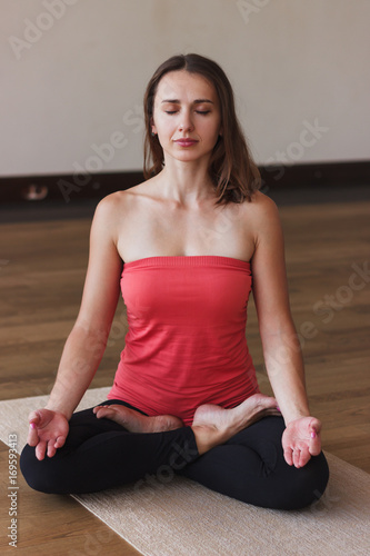 Woman makes yoga exercises