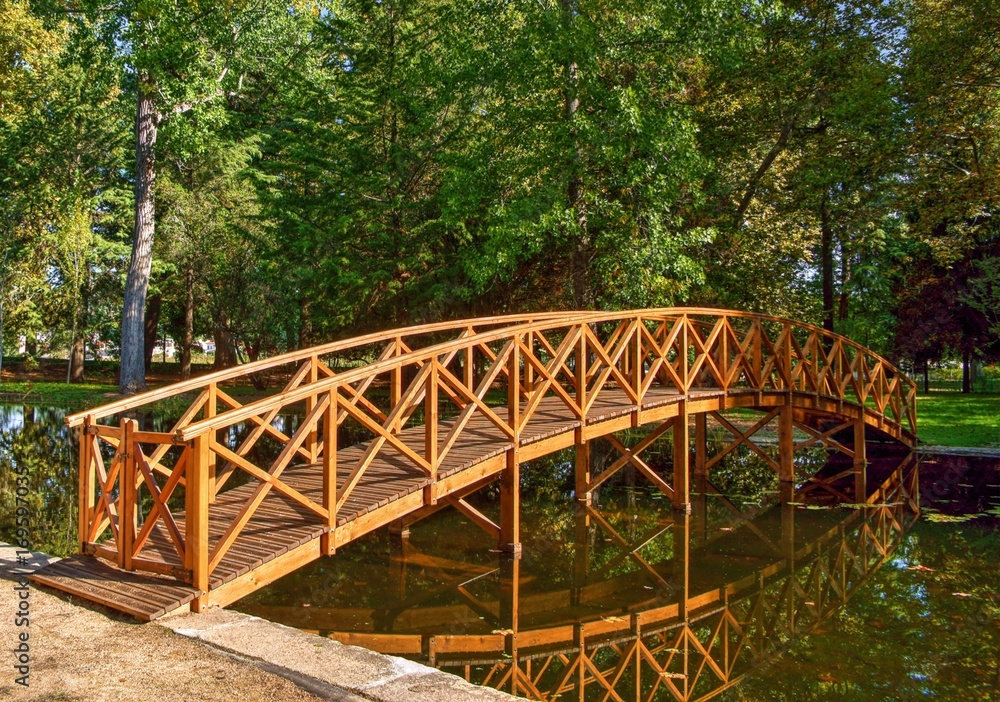 Bridge over garden lake in Vidago, Portugal Bridge over garden lake in Vidago, Portugal