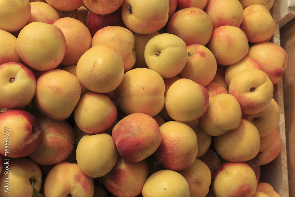 Vegan food. Fresh Peaches, Nectarines, isolated background Vegan food. Fresh Peaches, Nectarines, isolated background