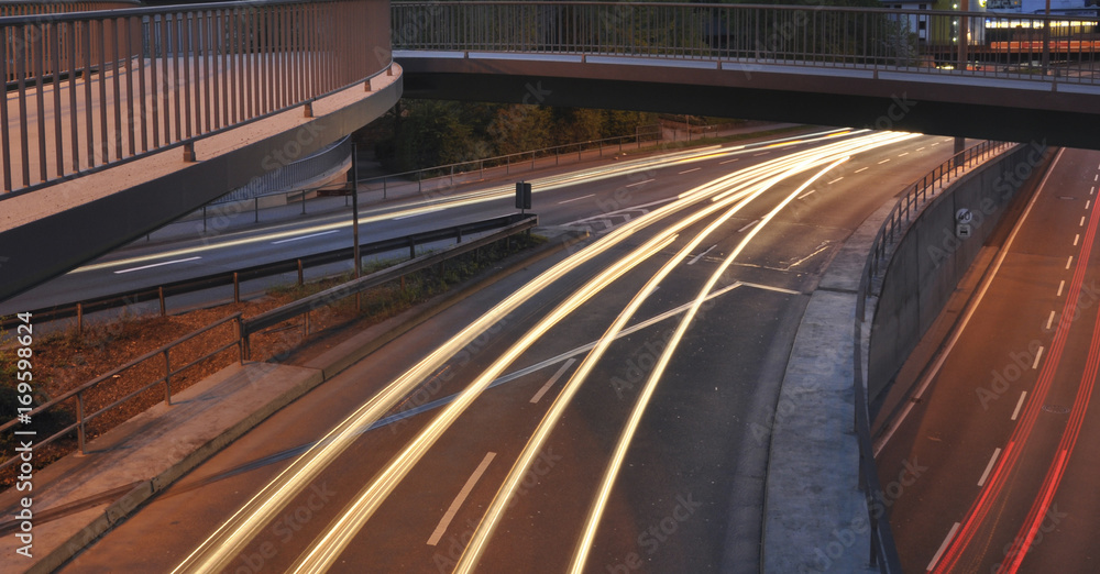 Car lights on german highway construction site with signs at night, long exposure photo of traffic Car lights on german highway construction site with signs at night, long exposure photo of traffic