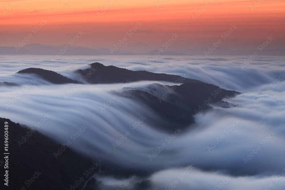 Amazing wave formed by a cloudsea at sunrise in Aralar Mountains (Navarre, Spain)