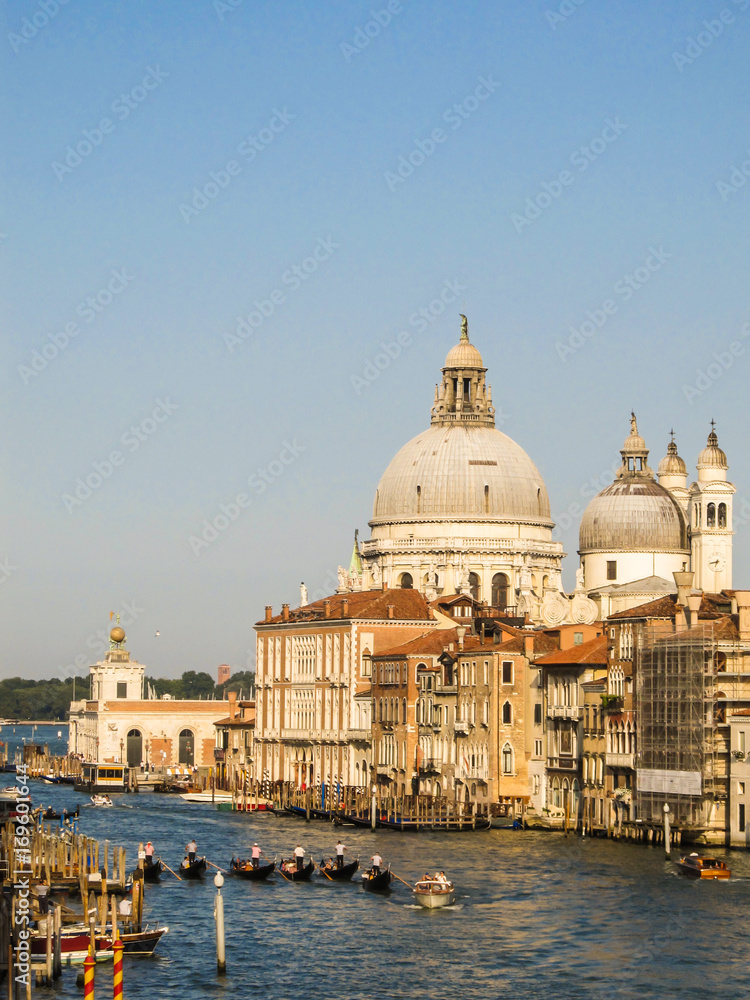 Grand Canal with gondolas and the Basilica di Santa Maria della Salute in the background (Venice, Italy)