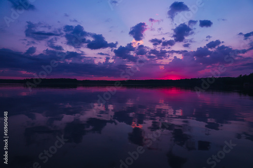 Beautiful landscape with the sunset on the Urals lake