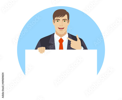 Businessman holding white blank poster and pointing at himself