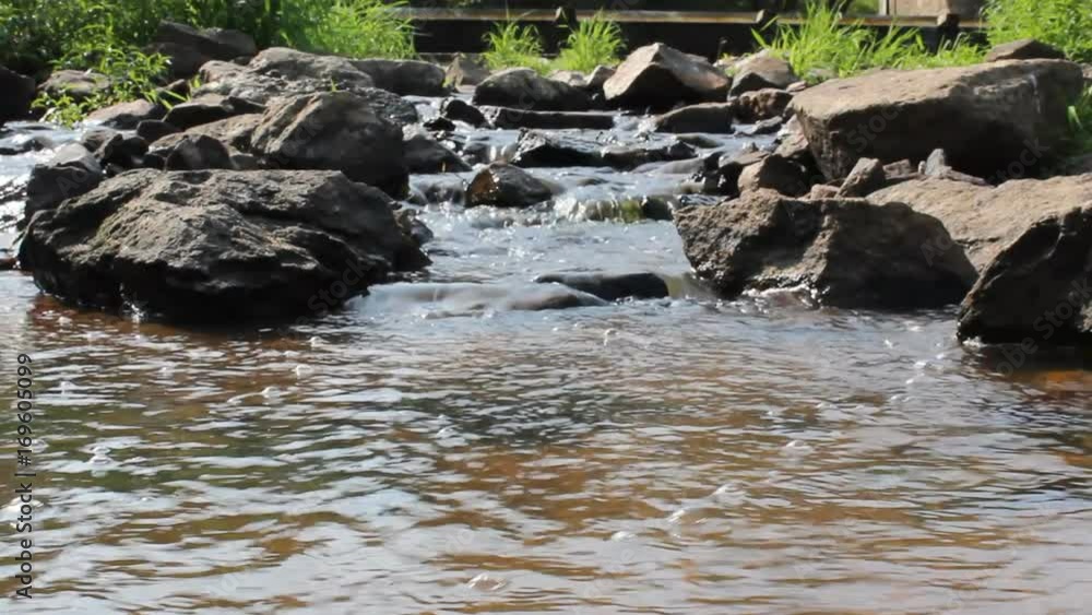 Small weir on stones with water Small weir on stones with water
