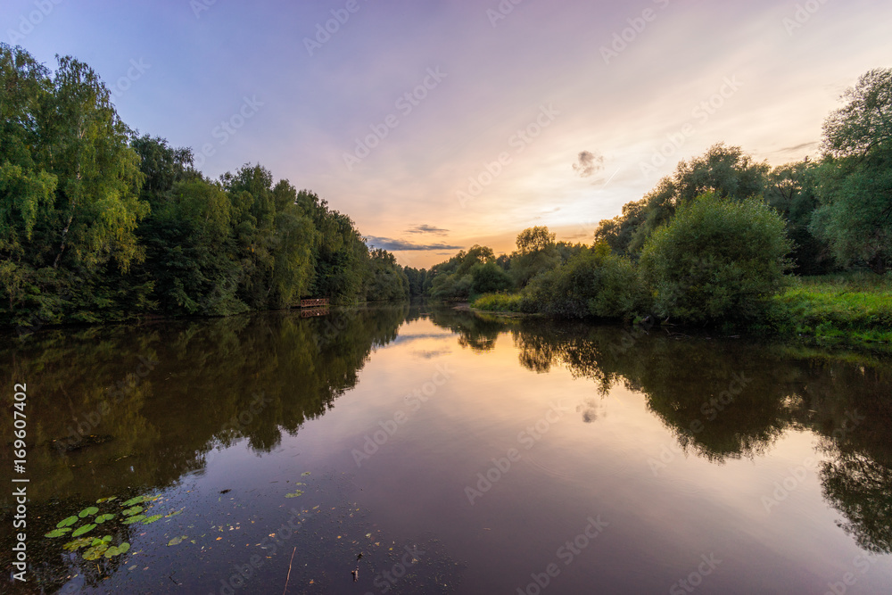 Wonderful scenery picturesque sunset on calm river
