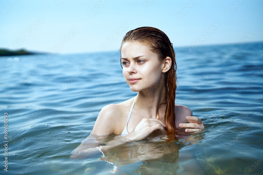 beautiful woman is swimming in the sea beautiful woman is swimming in the sea