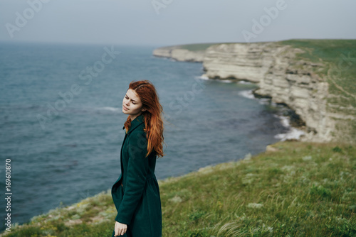 woman in the mountains by the sea