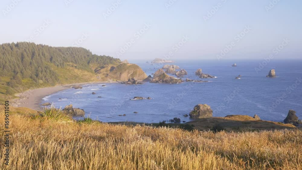 Locked down view at sunset of Lone Ranch Beach as seen from Cape Ferrelo in the Samuel H. Boardman State Scenic Corridor, southern Oregon coast. Locked down view at sunset of Lone Ranch Beach as seen from Cape Ferrelo in the Samuel H. Boardman State Scenic Corridor, southern Oregon coast.