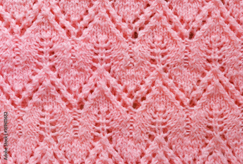 Openwork pattern on the knitted product with spokes made of woolen thread in pink  handmade