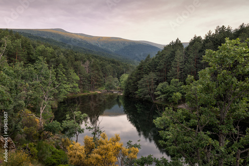 Amazing sunrise on a mountain lake in Rascafria, Madrid. Spain