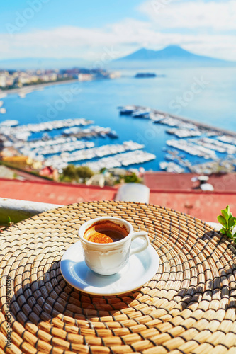 Cup of coffee with view on Vesuvius mount in Naples