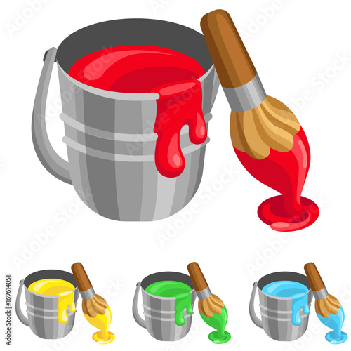 The steel bucket with paint and brush / There is steel bucket with paint in it. Near the bucket stands brush in paint
