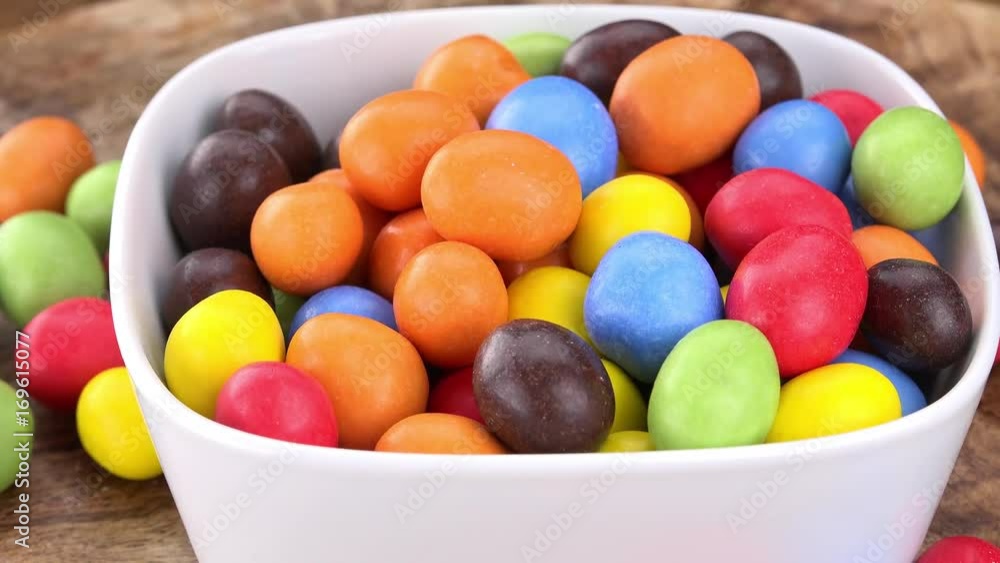 Chocolate Covered Peanuts (rotating on a wooden plate; seamless loopable; 4K) Chocolate Covered Peanuts (rotating on a wooden plate; seamless loopable; 4K)