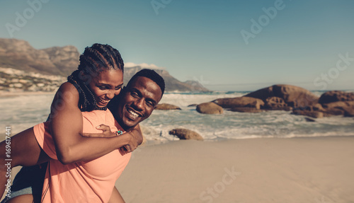 Young couple enjoying at the beach