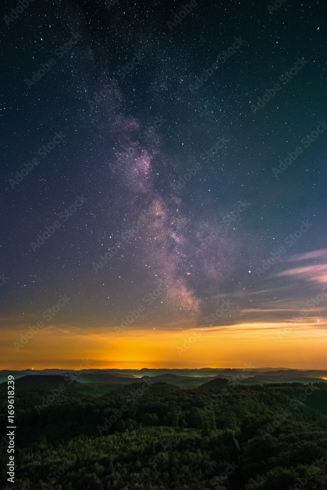 The center of the Milky Way as seen from the Luitpold Tower in the Palatinate Forest near Merzalben in Germany.