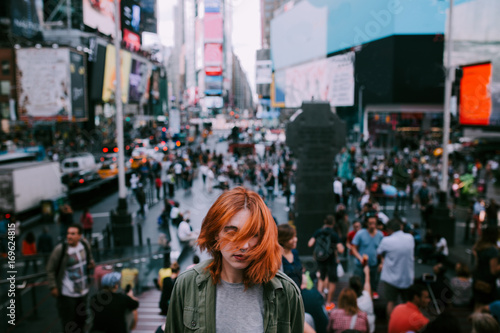 woman shaking her hair in times square