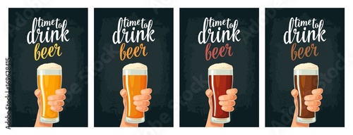 Male hand holding a glass with four types beer - light, white, red and dark.