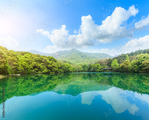 green water lake and mountain landscape in forest