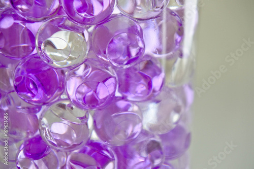 Close up clear purple and white gel ball in the bottle, look twinkle like a crystal