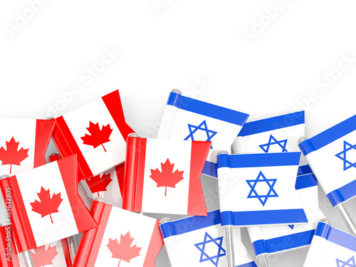 Flag pins of Canada and Israel isolated on white