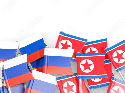 Flag pins of Russia and North Korea isolated on white