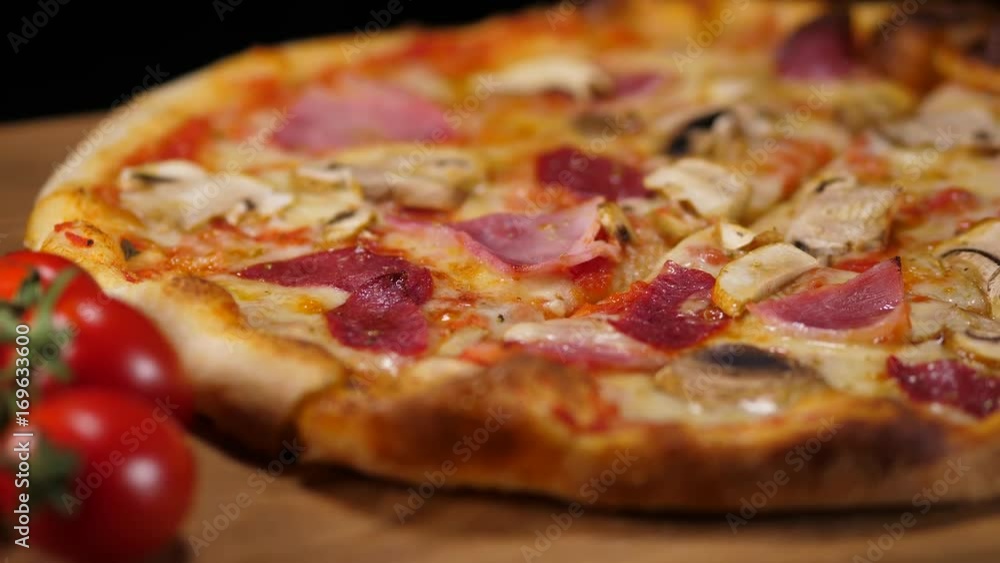 Hot pizza with ham and tomatoes Hot pizza with ham and tomatoes