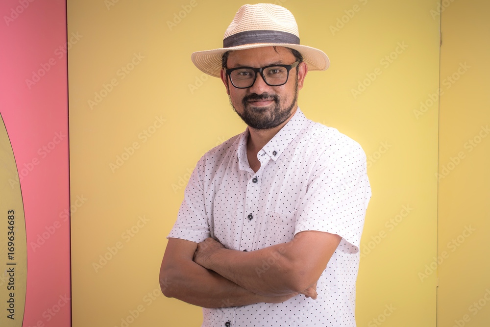 Portrait of smiling young hipster in studio. Portrait of smiling young hipster in studio.