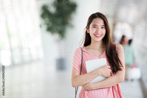 Young asian lady relax in city center