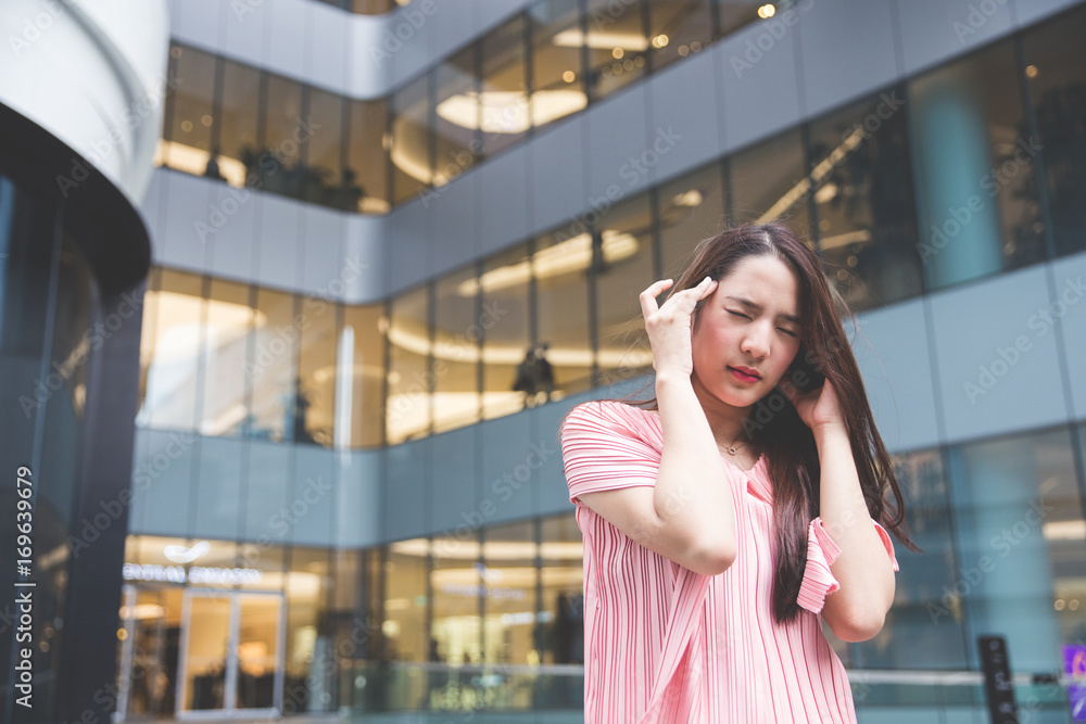 Fototapeta premium Young asian lady get headaches