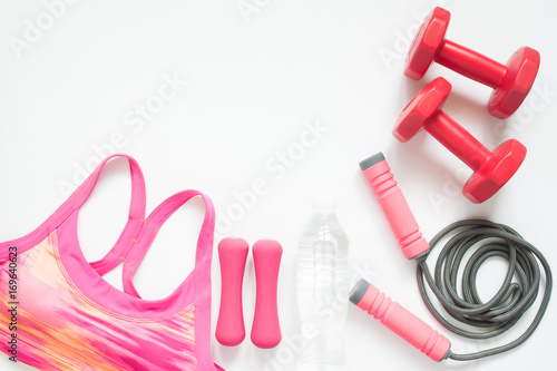 Flat lay of sport and workout equipments on white background