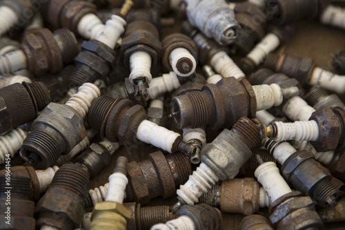 Isolated View of a Jumble of Old Used Sparkplugs