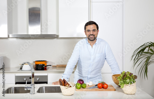 arab man preparing food in his urban apartment